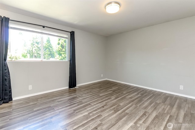 32206 27th Ave SW, Federal Way, WA 98032 - empty room featuring wood finished floors and baseboards