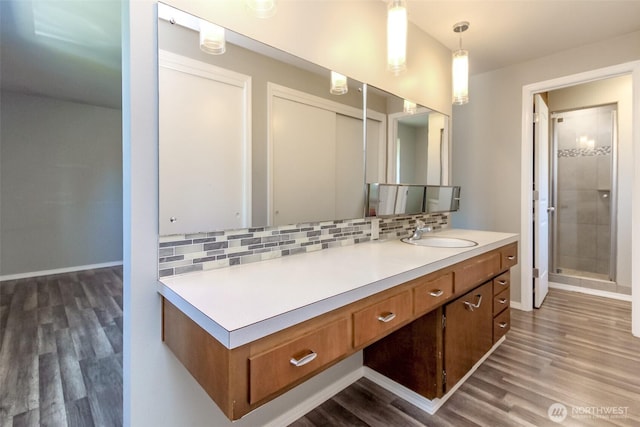 32206 27th Ave SW, Federal Way, WA 98032 - full bath with wood finished floors, vanity, decorative backsplash, and a stall shower