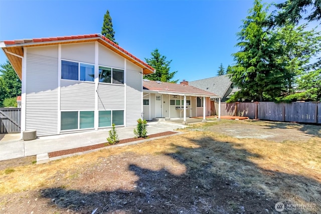32206 27th Ave SW, Federal Way, WA 98032 - rear view of property with a tile roof and a patio