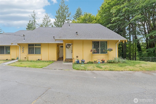 12912 62nd Ave NW Unit B5, Gig Harbor, WA 98332 - view of front facade featuring stucco siding and a shingled roof
