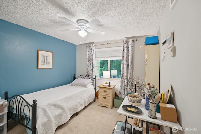 12912 62nd Ave NW Unit B5, Gig Harbor, WA 98332 - bedroom featuring carpet floors, a textured ceiling, and a ceiling fan