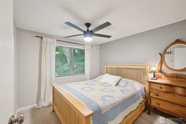 12912 62nd Ave NW Unit B5, Gig Harbor, WA 98332 - carpeted bedroom featuring a textured ceiling and a ceiling fan