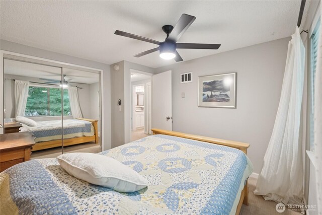 12912 62nd Ave NW Unit B5, Gig Harbor, WA 98332 - bedroom featuring a closet, carpet, and ceiling fan