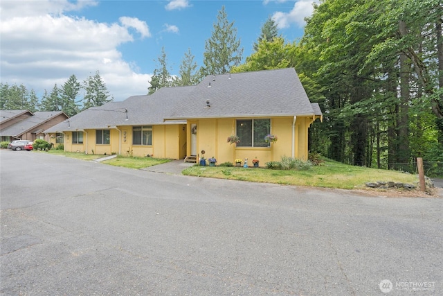 12912 62nd Ave NW Unit B5, Gig Harbor, WA 98332 - view of front of house with stucco siding and roof with shingles
