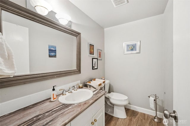 12912 62nd Ave NW Unit B5, Gig Harbor, WA 98332 - half bath featuring vanity and wood finished floors