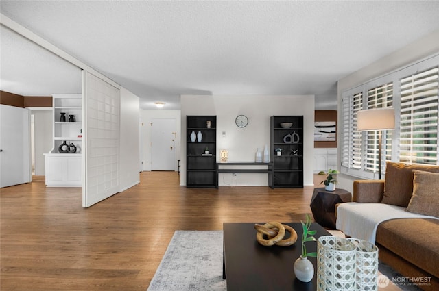 5915 Highway Pl Unit 403, Everett, WA 98203 - living area featuring wood finished floors and a textured ceiling