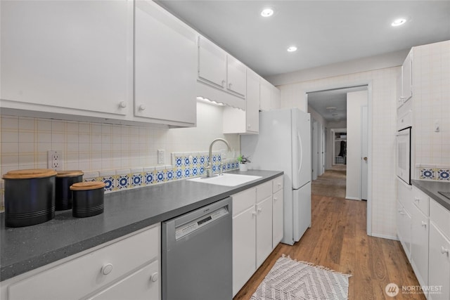 5915 Highway Pl Unit 403, Everett, WA 98203 - kitchen featuring white appliances, white cabinets, backsplash, and recessed lighting