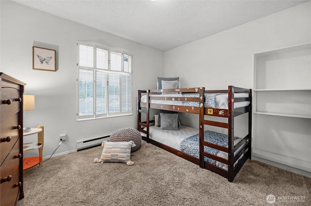 5915 Highway Pl Unit 403, Everett, WA 98203 - bedroom featuring carpet flooring, a baseboard radiator, and a textured ceiling