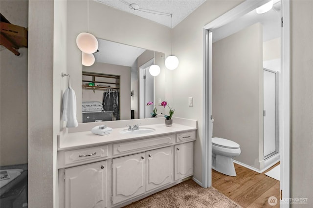 5915 Highway Pl Unit 403, Everett, WA 98203 - full bathroom with vanity, a shower stall, and wood finished floors