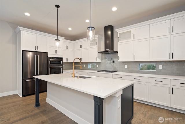 7585 S 130th Pl, Seattle, WA 98178 - kitchen featuring appliances with stainless steel finishes, wall chimney exhaust hood, recessed lighting, backsplash, and white cabinets