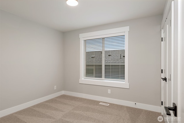 7585 S 130th Pl, Seattle, WA 98178 - unfurnished room with light carpet and baseboards