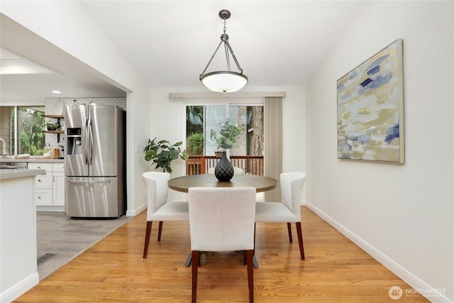 10435 NE 135th Pl, Kirkland, WA 98034 - dining space featuring plenty of natural light and light wood finished floors