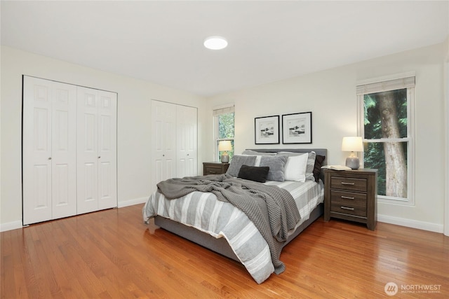 10435 NE 135th Pl, Kirkland, WA 98034 - bedroom with two closets and light wood-style floors