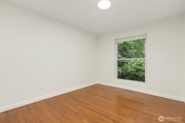 10435 NE 135th Pl, Kirkland, WA 98034 - empty room with baseboards and wood finished floors