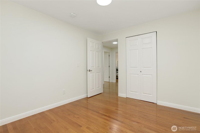10435 NE 135th Pl, Kirkland, WA 98034 - unfurnished bedroom featuring light wood-style flooring and a closet