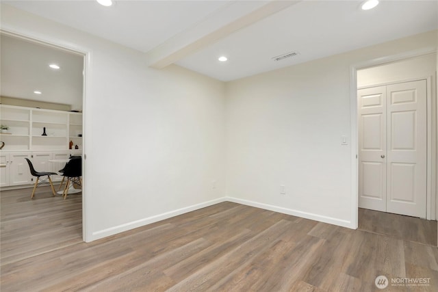 10435 NE 135th Pl, Kirkland, WA 98034 - unfurnished room with recessed lighting, wood finished floors, beamed ceiling, and a desk