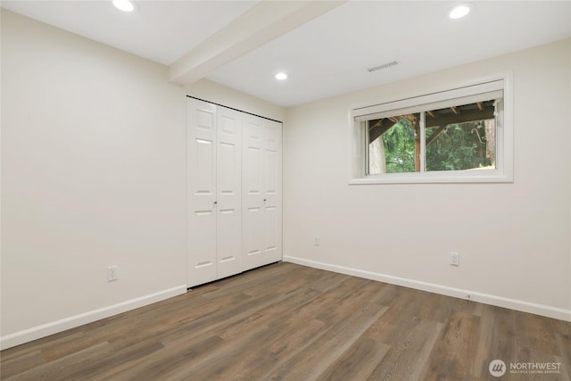 10435 NE 135th Pl, Kirkland, WA 98034 - unfurnished bedroom with recessed lighting, wood finished floors, beam ceiling, and a closet