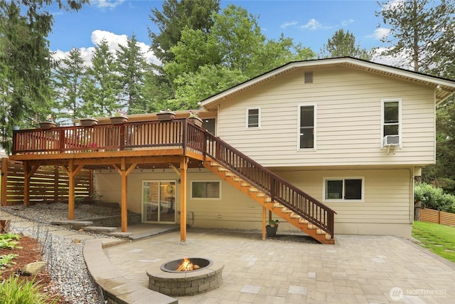 10435 NE 135th Pl, Kirkland, WA 98034 - back of property with stairway, a fire pit, a deck, and a patio