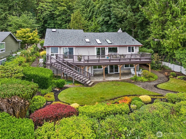 6600 Klein St NW, Olympia, WA 98502 - back of house featuring a wooden deck, stairs, a patio area, a chimney, and a forest view