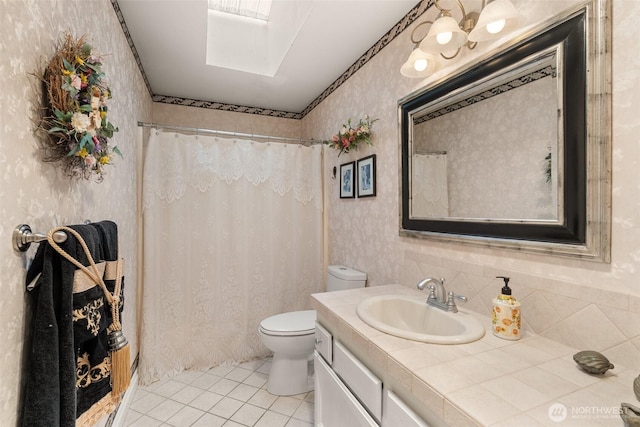 6600 Klein St NW, Olympia, WA 98502 - bathroom with wallpapered walls, tile patterned floors, a skylight, vanity, and curtained shower