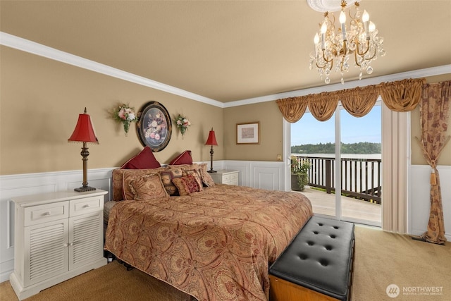 6600 Klein St NW, Olympia, WA 98502 - bedroom with access to outside, carpet, a chandelier, a wainscoted wall, and ornamental molding