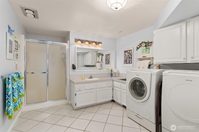 6600 Klein St NW, Olympia, WA 98502 - laundry room featuring independent washer and dryer and light tile patterned flooring