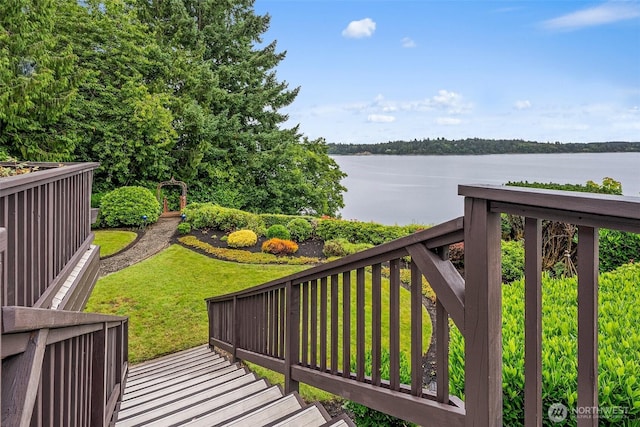 6600 Klein St NW, Olympia, WA 98502 - wooden deck featuring a water view and a lawn