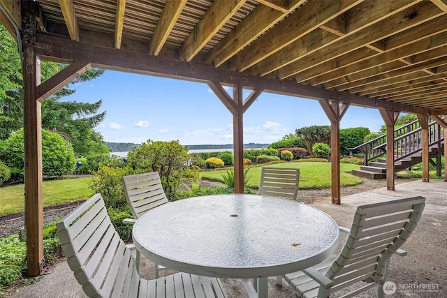 6600 Klein St NW, Olympia, WA 98502 - view of patio with stairway, outdoor dining area, and a water view