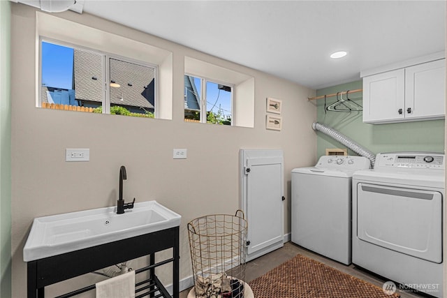 206 S Miller St, Wenatchee, WA 98801 - washroom with cabinet space, separate washer and dryer, recessed lighting, and baseboards