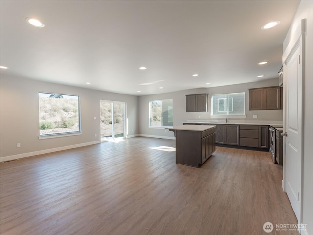 22 Salmon Dr, Wenatchee, WA 98801 - kitchen featuring a center island, open floor plan, light wood-type flooring, recessed lighting, and light countertops