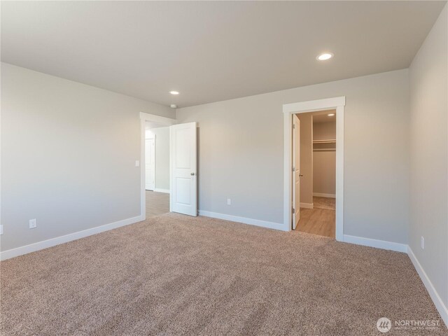 22 Salmon Dr, Wenatchee, WA 98801 - unfurnished bedroom featuring light carpet, recessed lighting, and a spacious closet