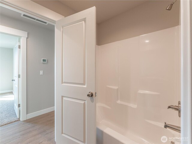 22 Salmon Dr, Wenatchee, WA 98801 - bathroom with wood finished floors and shower / bathtub combination