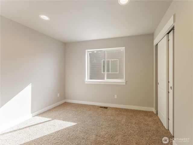 22 Salmon Dr, Wenatchee, WA 98801 - unfurnished bedroom with carpet flooring, a closet, and recessed lighting