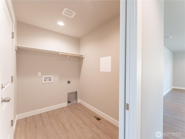22 Salmon Dr, Wenatchee, WA 98801 - laundry room featuring washer hookup, electric dryer hookup, light wood finished floors, and recessed lighting
