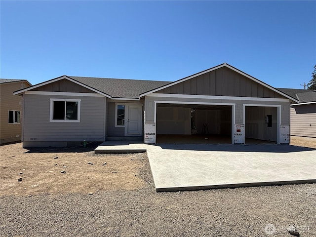 22 Salmon Dr, Wenatchee, WA 98801 - view of front facade with a garage, board and batten siding, and driveway