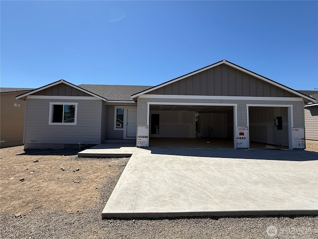 22 Salmon Dr, Wenatchee, WA 98801 - view of front of house featuring a garage, driveway, and board and batten siding