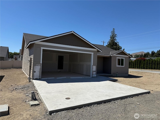 22 Salmon Dr, Wenatchee, WA 98801 - view of front of house featuring an attached garage, a patio area, and concrete driveway