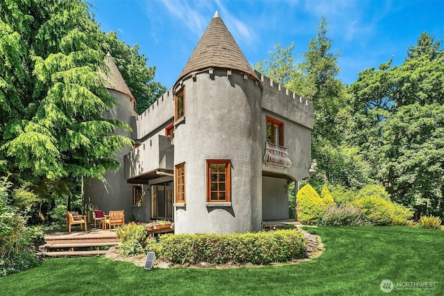 24917 Dockton Rd SW, Vashon, WA 98070 - rear view of house featuring a yard, a balcony, a deck, and stucco siding