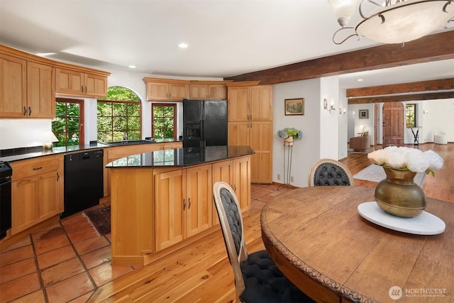 24917 Dockton Rd SW, Vashon, WA 98070 - kitchen with black appliances, a kitchen island, healthy amount of natural light, dark countertops, and recessed lighting
