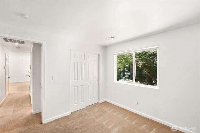 3003 193rd Pl SE, Bothell, WA 98012 - unfurnished bedroom featuring light colored carpet and a closet