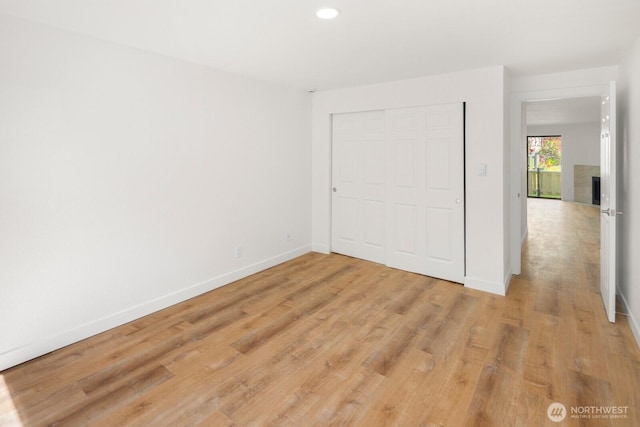 2020 Grant Ave S Unit B103, Renton, WA 98055 - unfurnished bedroom featuring light wood-style floors, baseboards, a closet, and recessed lighting