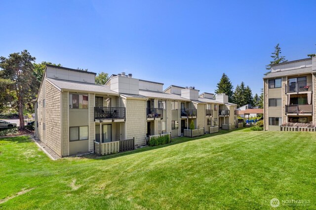 2020 Grant Ave S Unit B103, Renton, WA 98055 - view of building exterior with a residential view