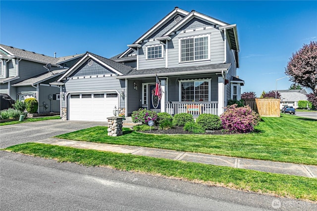 17716 25th Ave E, Tacoma, WA 98445 - view of front of home with a porch, asphalt driveway, and a garage