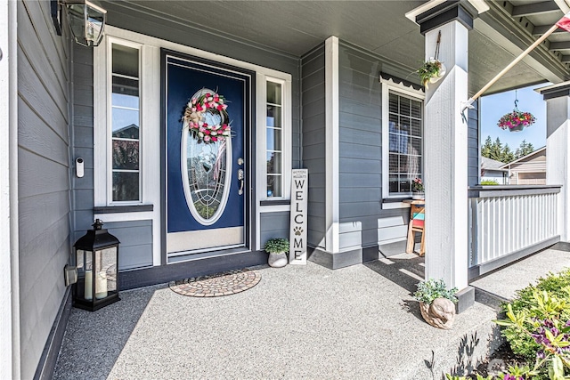 17716 25th Ave E, Tacoma, WA 98445 - view of exterior entry with a porch