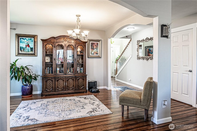 17716 25th Ave E, Tacoma, WA 98445 - foyer featuring dark wood-type flooring, a chandelier, arched walkways, and stairway