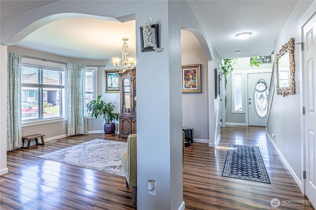 17716 25th Ave E, Tacoma, WA 98445 - foyer featuring arched walkways, wood finished floors, and a chandelier