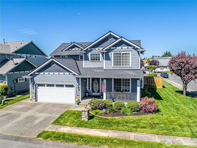 17716 25th Ave E, Tacoma, WA 98445 - view of front of house with asphalt driveway, a garage, a porch, roof with shingles, and stone siding