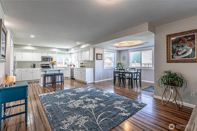 17716 25th Ave E, Tacoma, WA 98445 - living area featuring wood finished floors, healthy amount of natural light, and recessed lighting