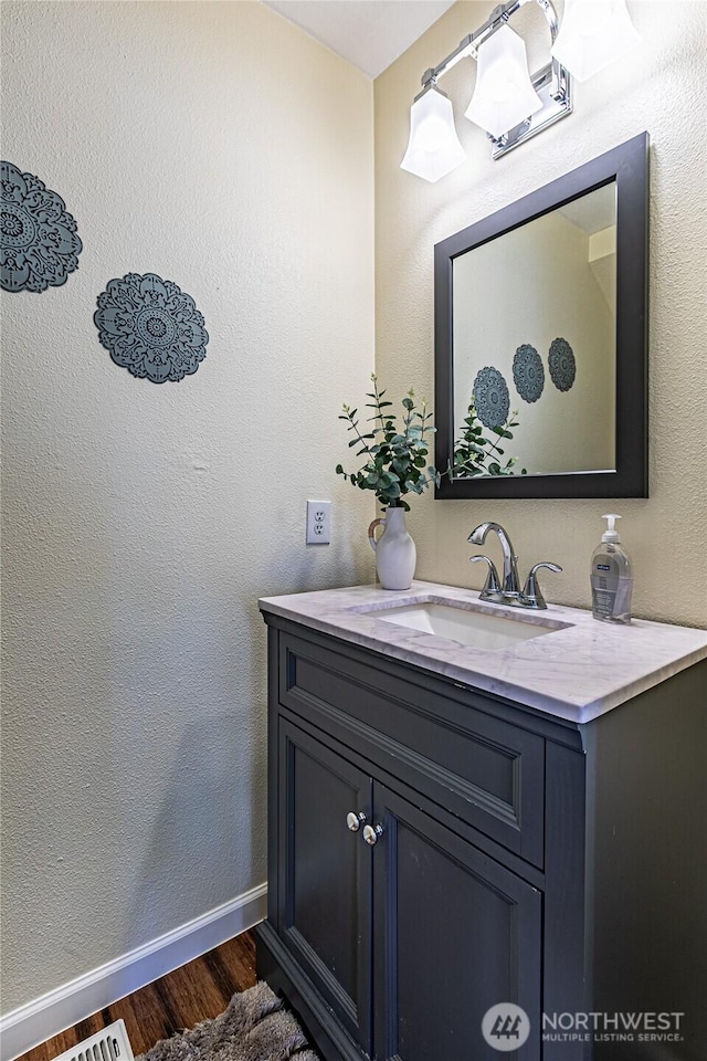 17716 25th Ave E, Tacoma, WA 98445 - bathroom with vanity and wood finished floors
