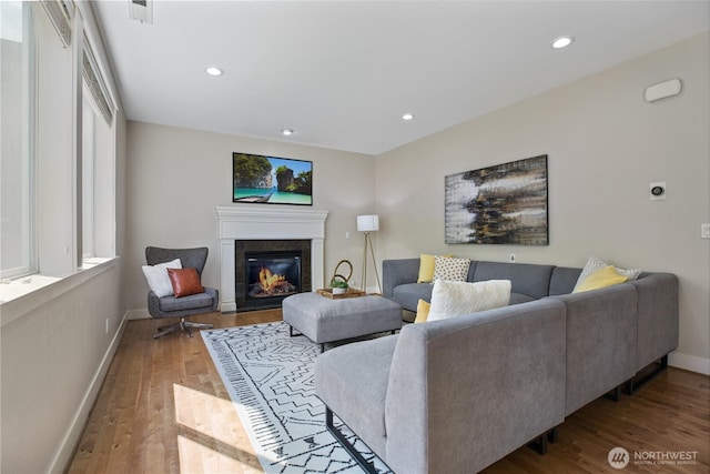 13020 112th Ave NE, Kirkland, WA 98034 - living area with wood finished floors, a glass covered fireplace, and recessed lighting
